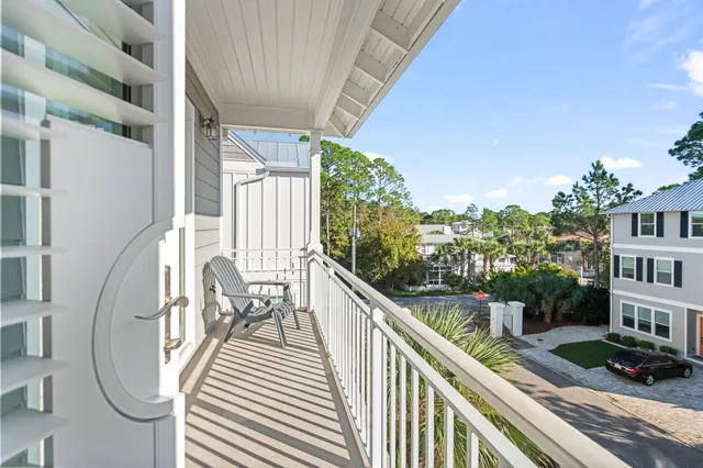 a view of a chair and table in the balcony