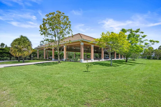 a kitchen with stainless steel appliances a refrigerator and a stove top oven