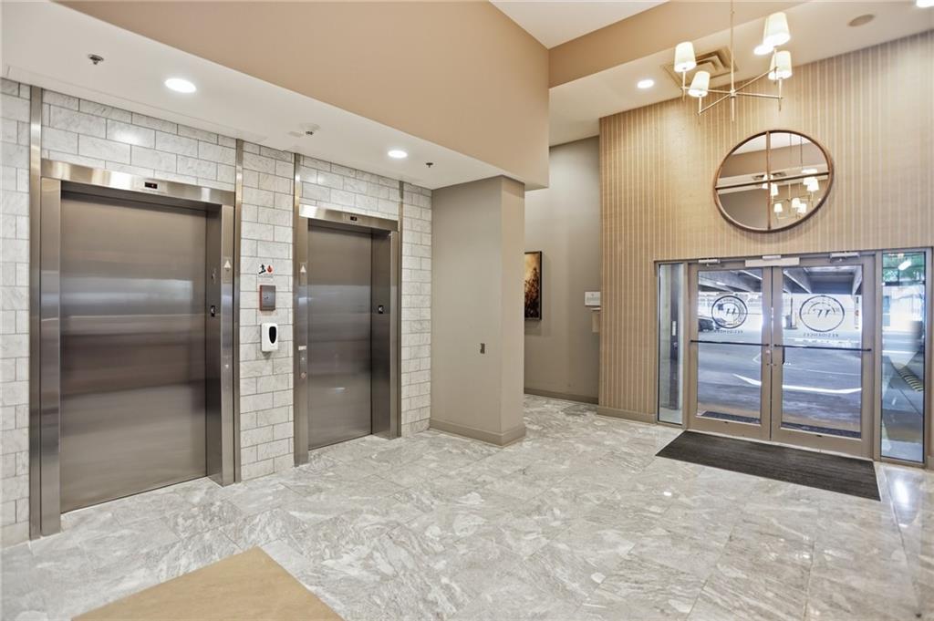 1100 Howell Mill Road Northwest, Unit 608 Atlanta, GA 30318 - Photo 32 of 37 a view of a hallway with elevator