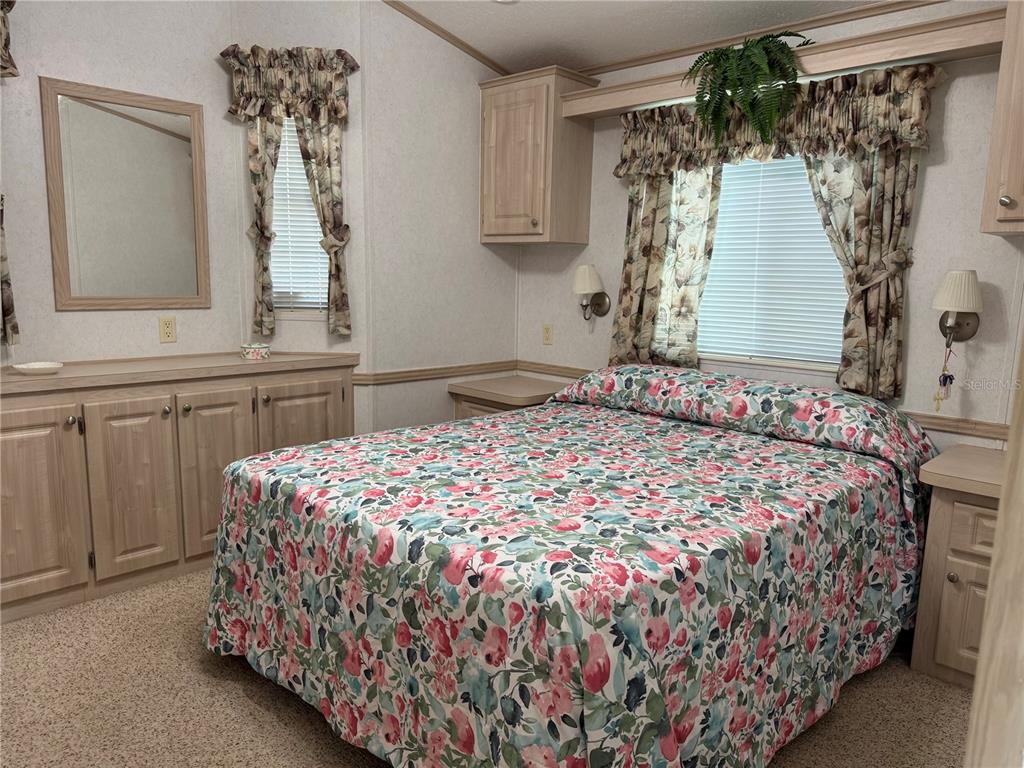 1385 Pine Island Drive St. Cloud, FL 34771 - Photo 12 of 28 a bedroom with a bed and a window