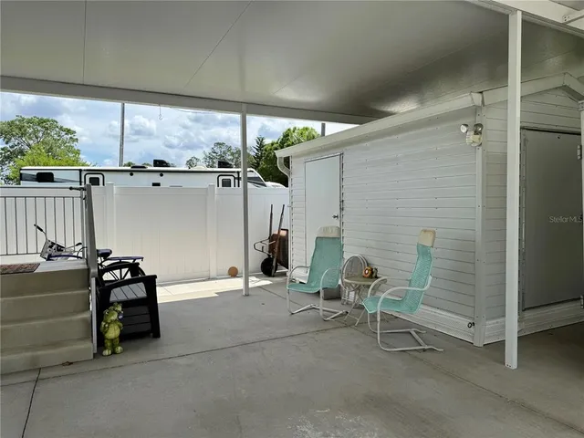 a view of two chairs in the room