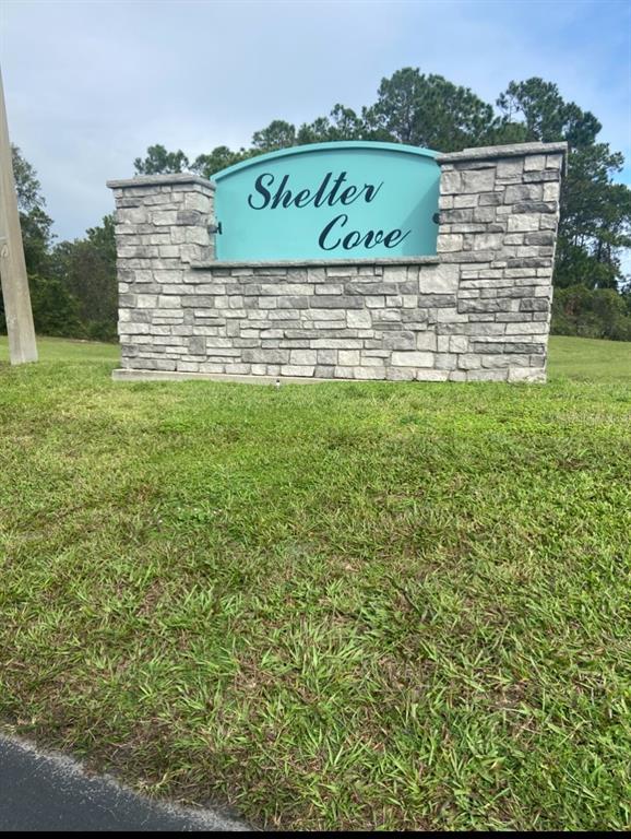 1385 Pine Island Drive St. Cloud, FL 34771 - Photo 18 of 28 a sign on the side of a building