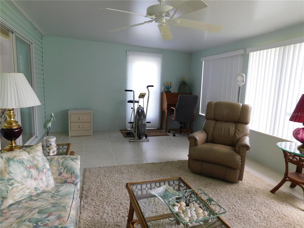 1385 Pine Island Drive St. Cloud, FL 34771 - Photo 4 of 28 a living room with furniture and a window