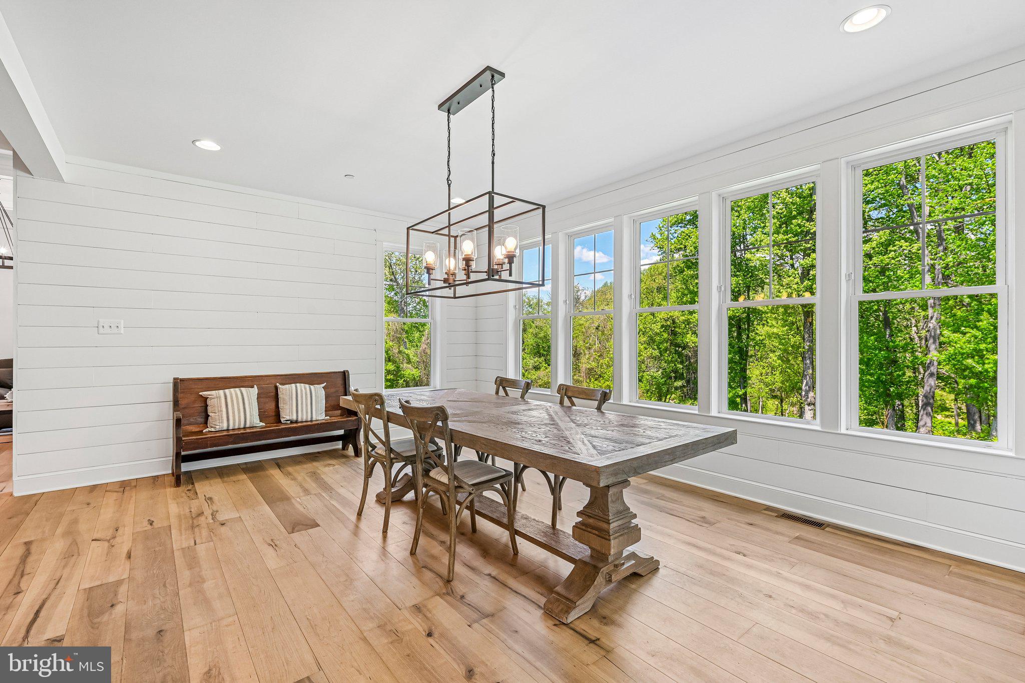 14516 Old Frederick Road Cooksville, MD 21723 - Photo 22 of 100 a view of a dining room with furniture window and wooden floor