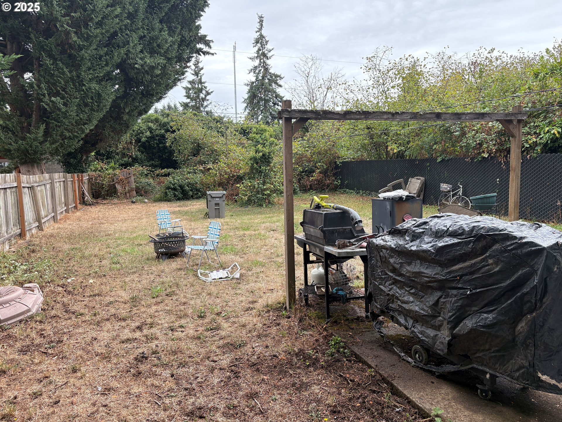 3460 Oxbow Way Eugene, OR 97401 - Photo 16 of 17 a view of a patio with a table chairs and a floor to ceiling window