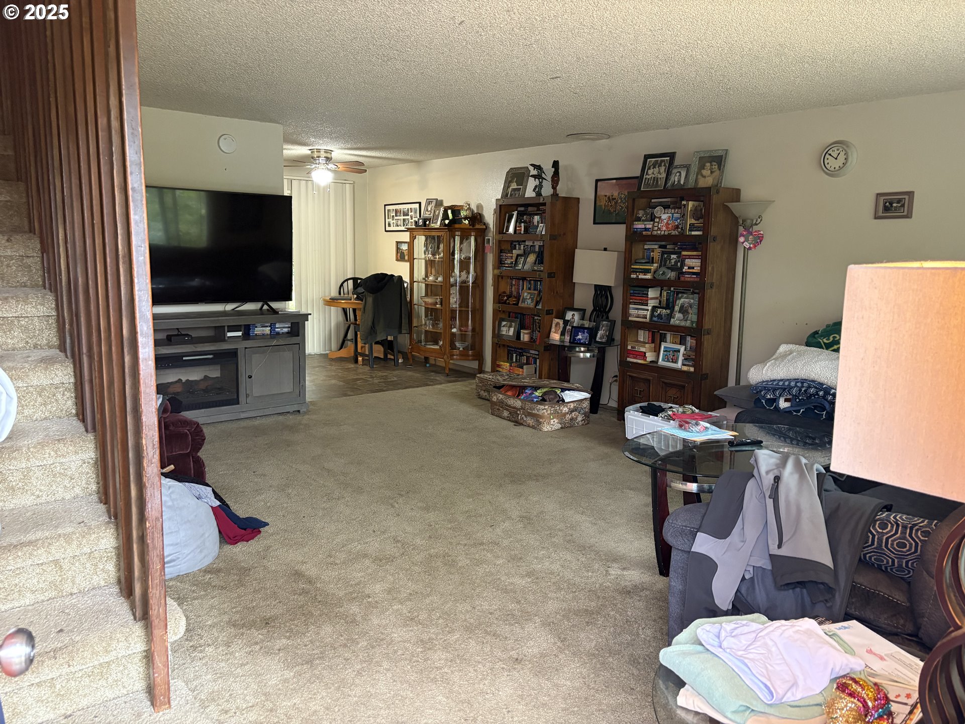 3460 Oxbow Way Eugene, OR 97401 - Photo 2 of 17 a room with gym equipment and a flat screen tv
