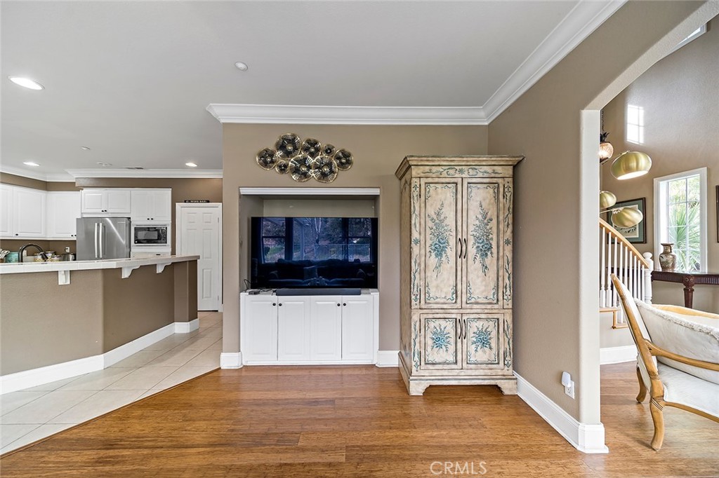 22 Via Sonrisa San Clemente, CA 92673 - Photo 13 of 59 a view of a livingroom with wooden floor and a kitchen space