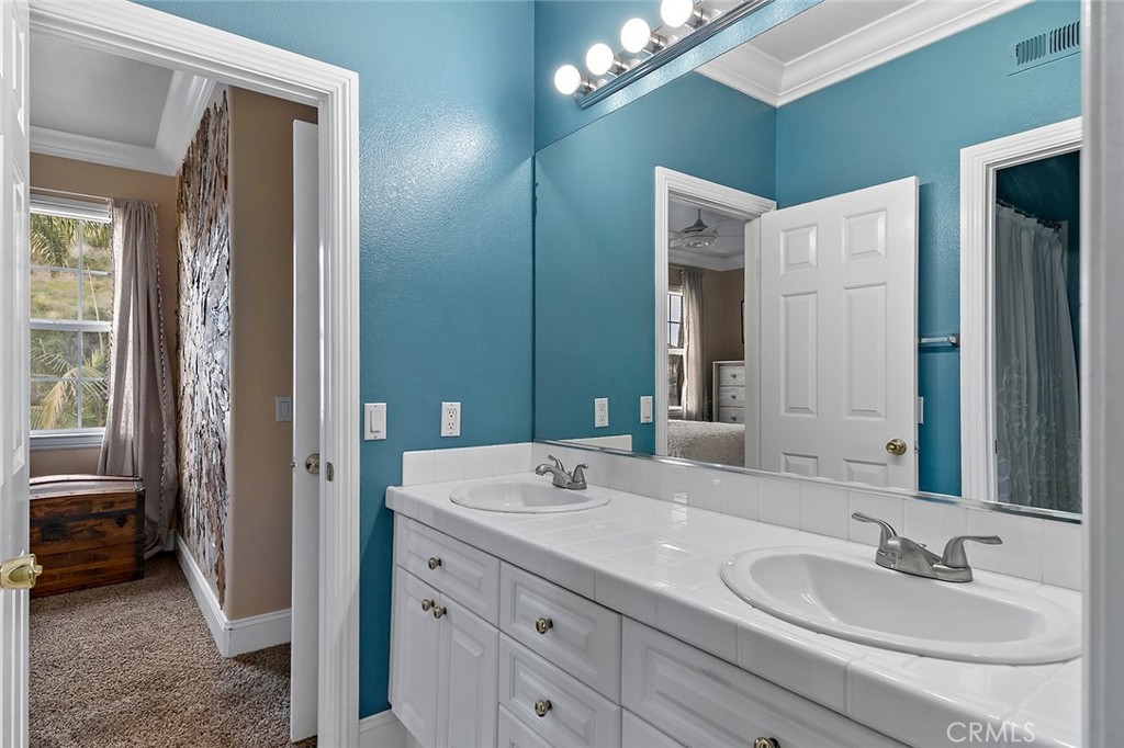 22 Via Sonrisa San Clemente, CA 92673 - Photo 35 of 59 a bathroom with a sink double vanity and a mirror