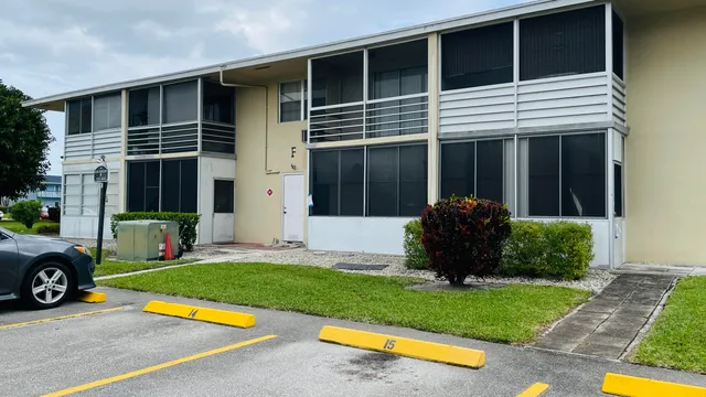 a view of a house with a yard and a garden