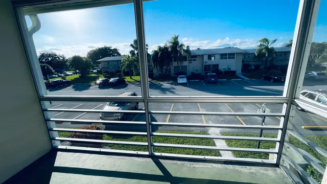 an empty room with wooden floor and closet
