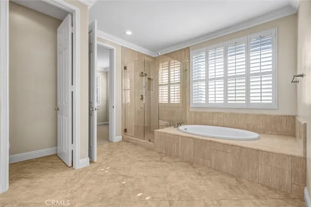 a spacious bathroom with a granite countertop sink and a mirror