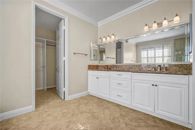 a view of room with window and ceiling fan