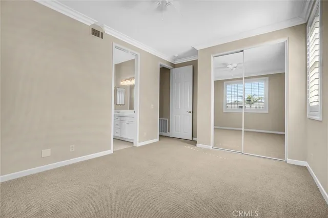 a bathroom with a sink vanity and a mirror