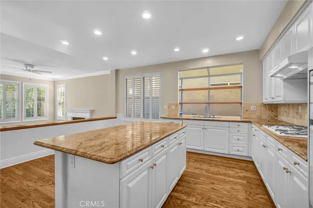 a kitchen with stainless steel appliances granite countertop a sink and a granite counter tops