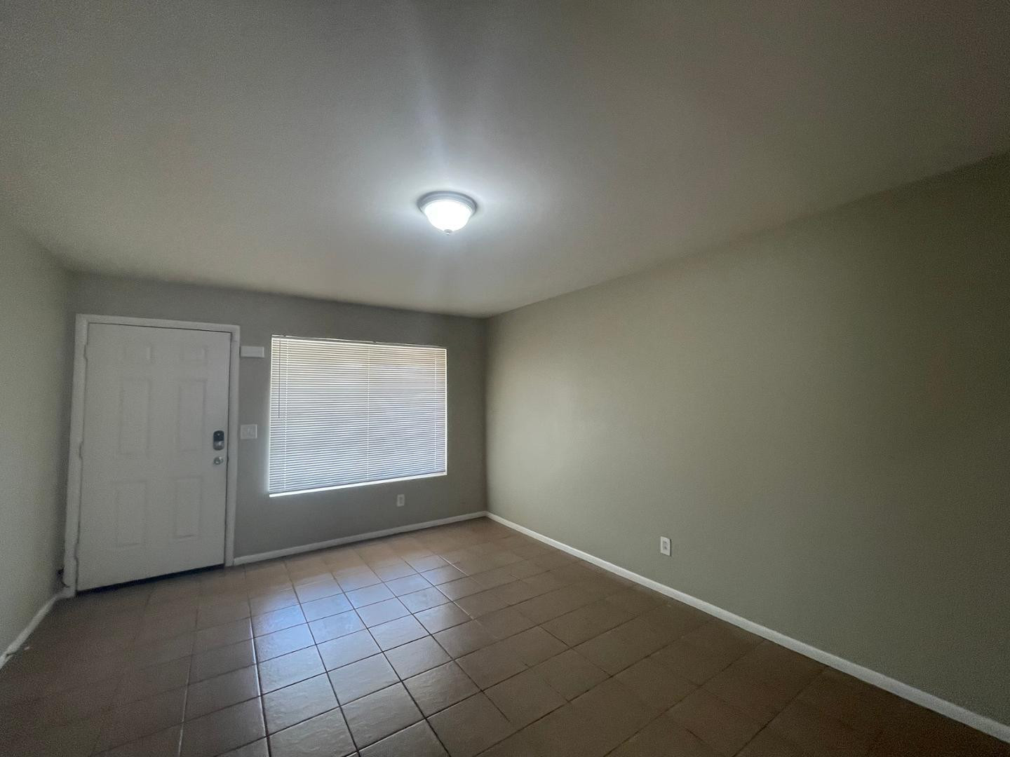 10902 West Montecito Avenue Phoenix, AZ 85037 - Photo 4 of 22 an empty room with windows