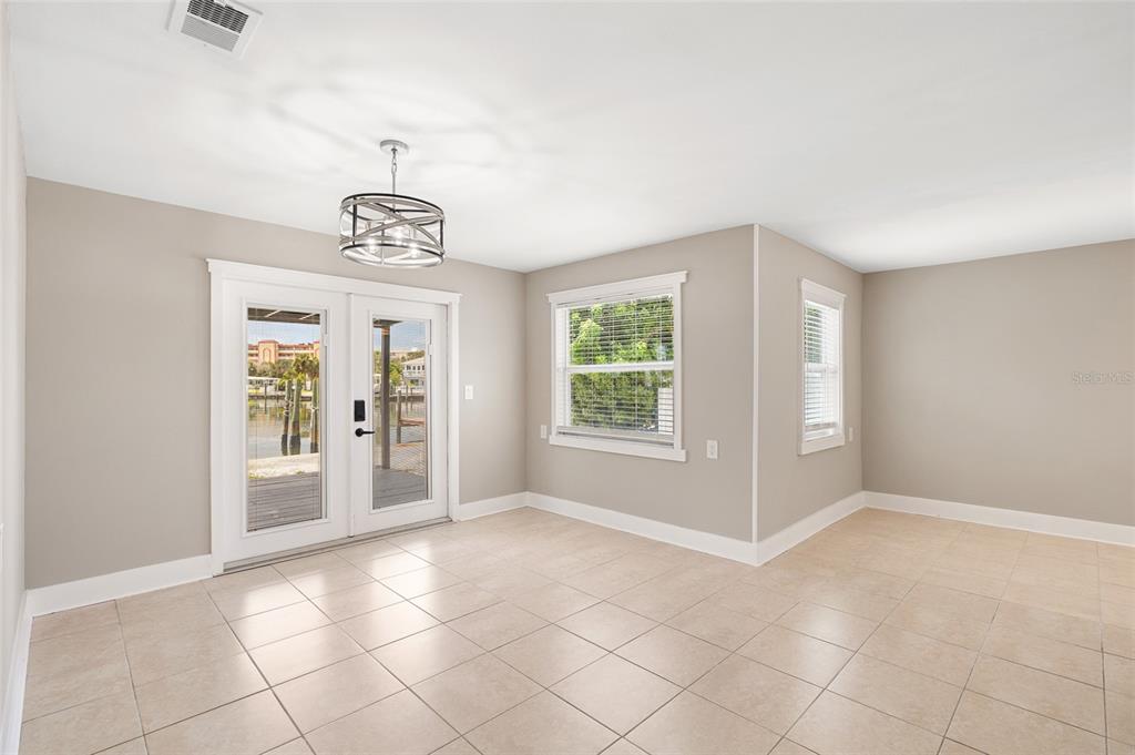 231 East Madeira Avenue Madeira Beach, FL 33708 - Photo 12 of 60 a view of an empty room with a window