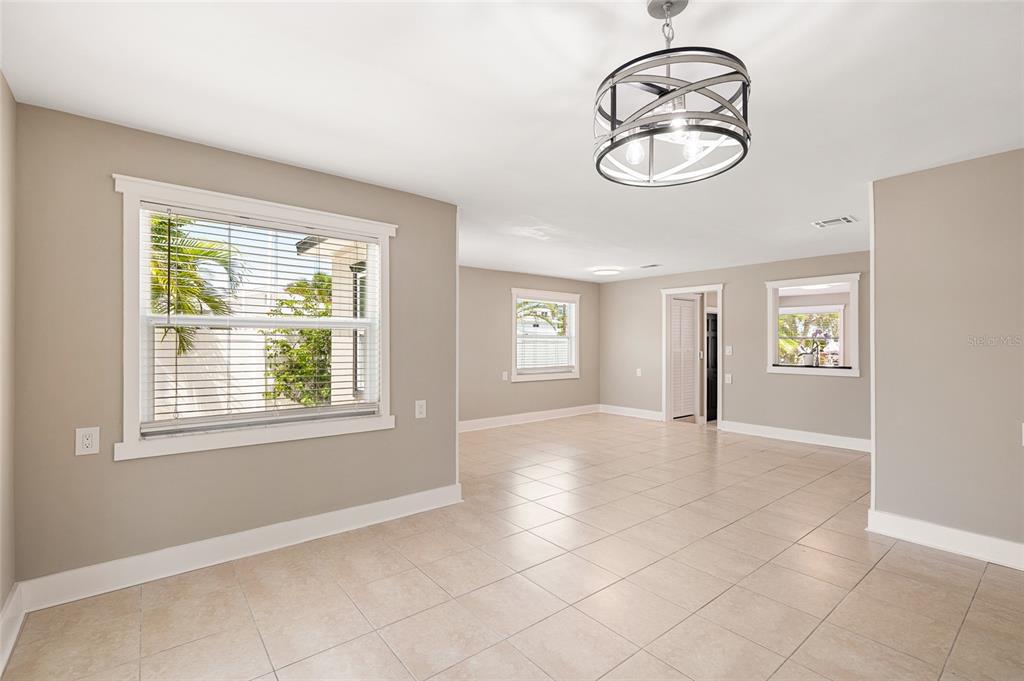 231 East Madeira Avenue Madeira Beach, FL 33708 - Photo 13 of 60 an empty room with windows and fan