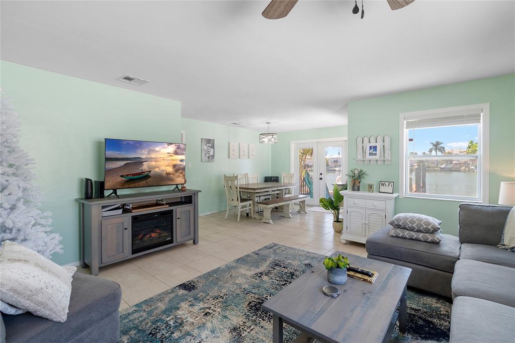 231 East Madeira Avenue Madeira Beach, FL 33708 - Photo 54 of 60 a living room with furniture and a flat screen tv