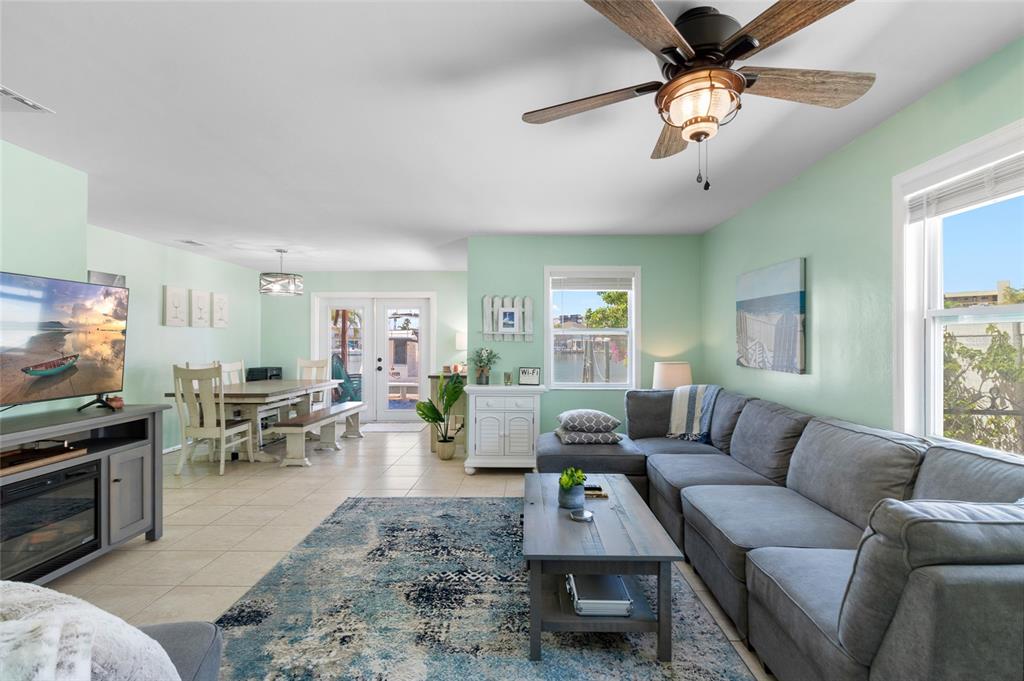 231 East Madeira Avenue Madeira Beach, FL 33708 - Photo 55 of 60 a living room with furniture and a flat screen tv