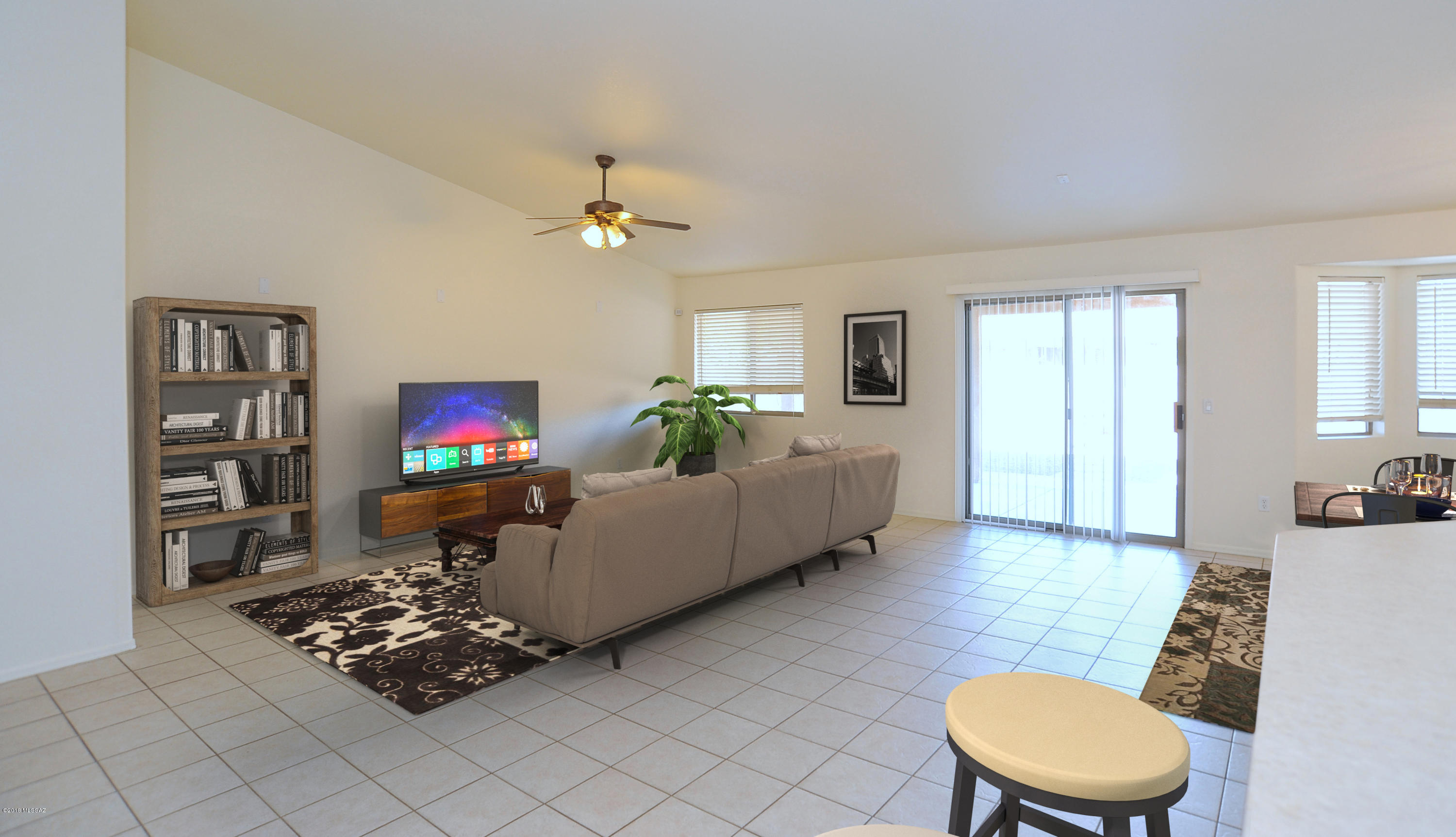 558 West Chatfield Street Vail, AZ 85641 - Photo 1 of 31 a living room with furniture a flat screen tv and a wall painting