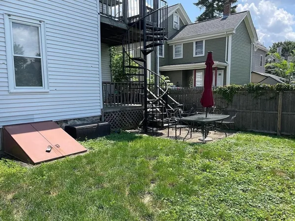 a backyard of a house with lots of green space