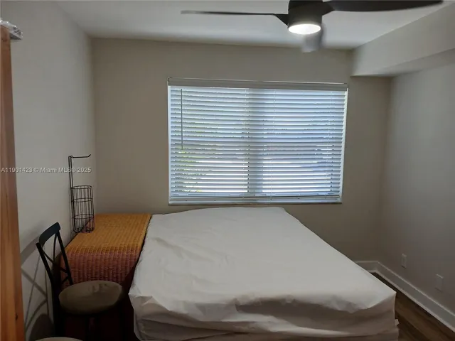 a bathroom with a blue sink and a window