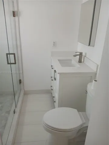 a bathroom with a toilet and a sink