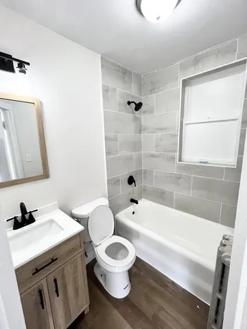 a bathroom with a sink a toilet and a bathtub