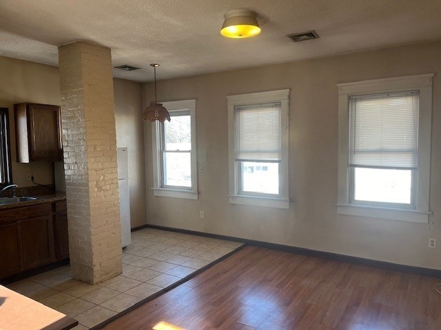 256 Broadway Taunton, MA 02780 - Photo 12 of 20 an empty room with wooden floor and windows