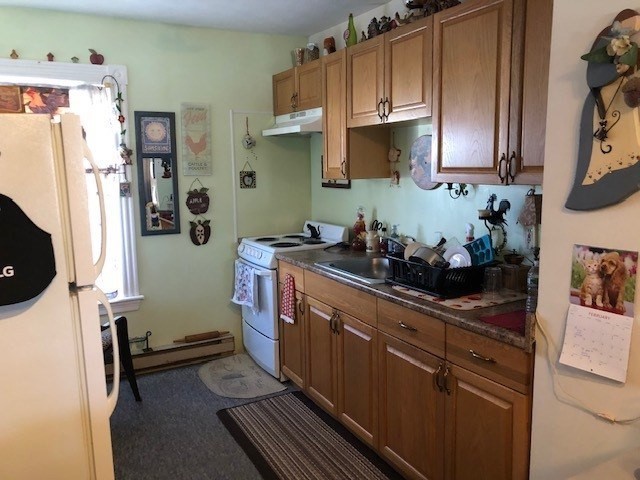 256 Broadway Taunton, MA 02780 - Photo 15 of 20 a kitchen with stainless steel appliances a sink a stove a refrigerator and cabinets