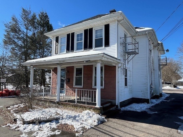 256 Broadway Taunton, MA 02780 - Photo 2 of 20 a front view of a house with a porch