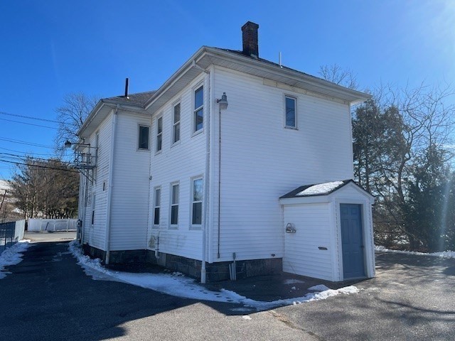 256 Broadway Taunton, MA 02780 - Photo 4 of 20 a front view of a house with a yard