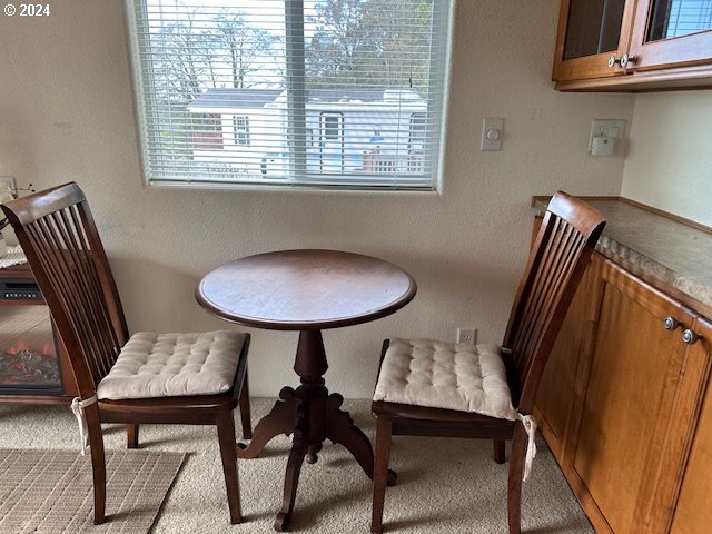 15061 Highway 101, Unit 4 Brookings, OR 97415 - Photo 11 of 12 a view of a dining room with furniture and window