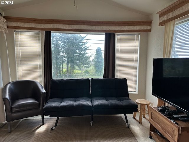 15061 Highway 101, Unit 4 Brookings, OR 97415 - Photo 7 of 12 a living room with furniture and a flat screen tv