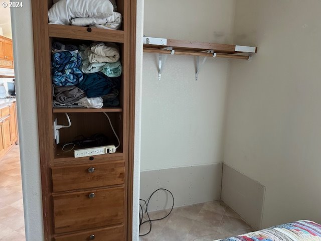15061 Highway 101, Unit 4 Brookings, OR 97415 - Photo 8 of 12 a room with a walk in closet and a window