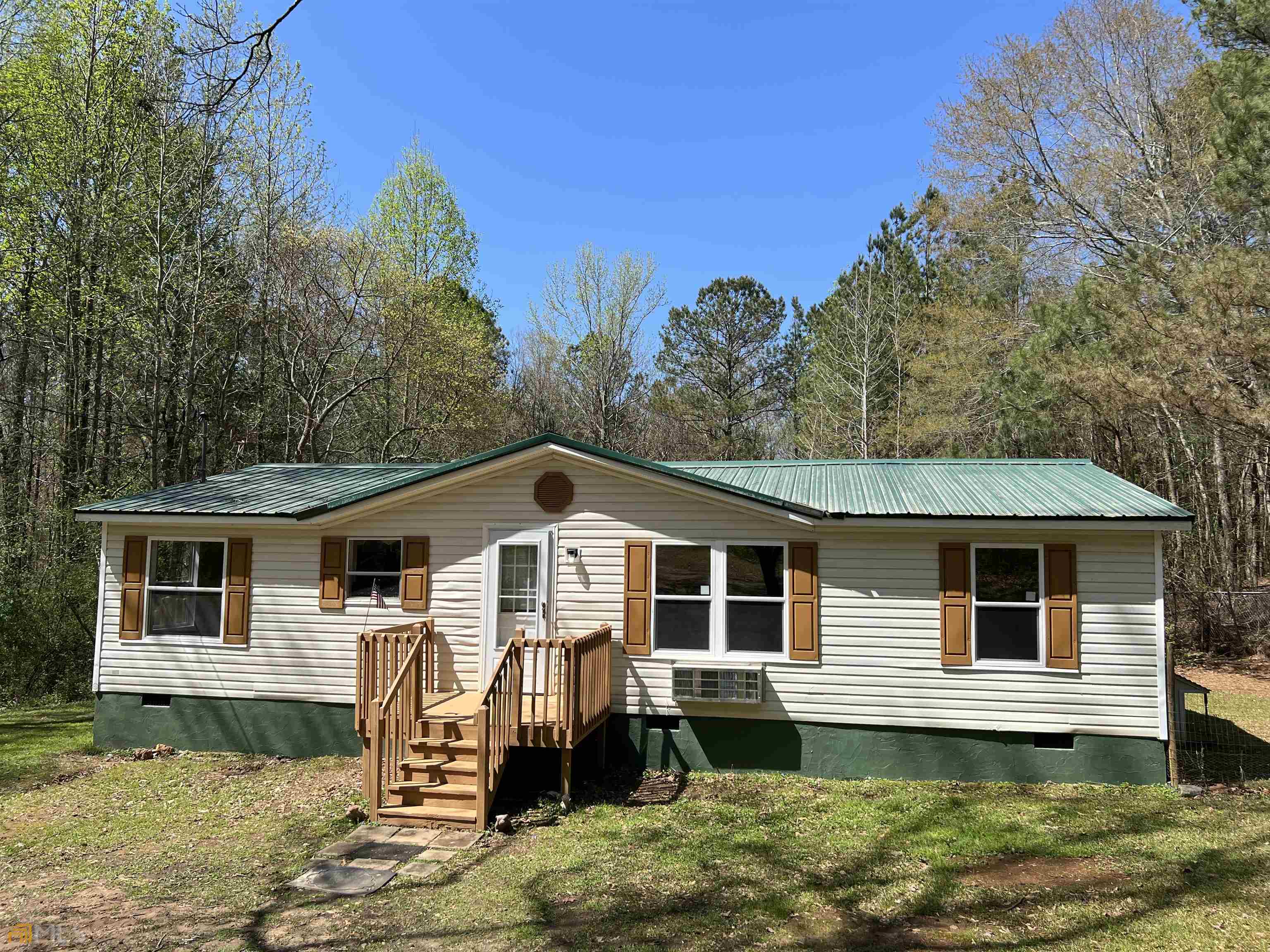 685 Craven Road Roopville, GA 30170 - Photo 1 of 1 a front view of a house with a yard