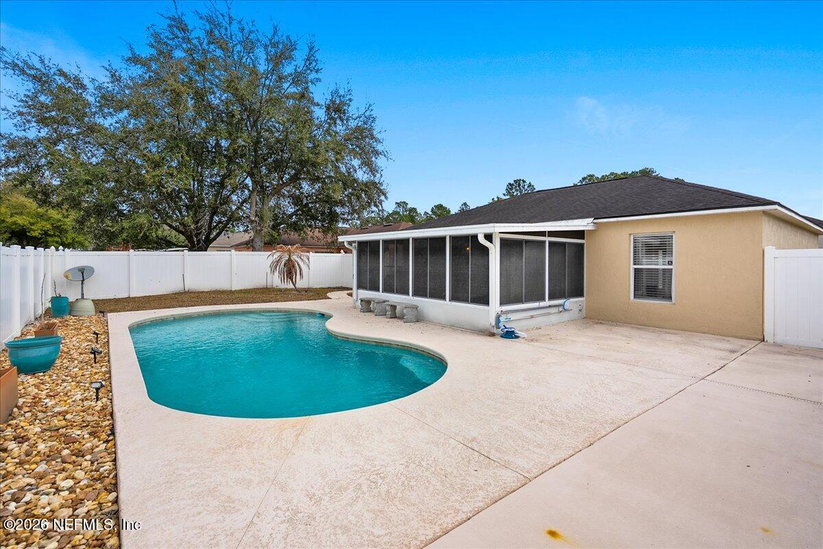 10310 Woodley Point Road Jacksonville, FL 32218 - Photo 24 of 30 a view of outdoor space yard and swimming pool