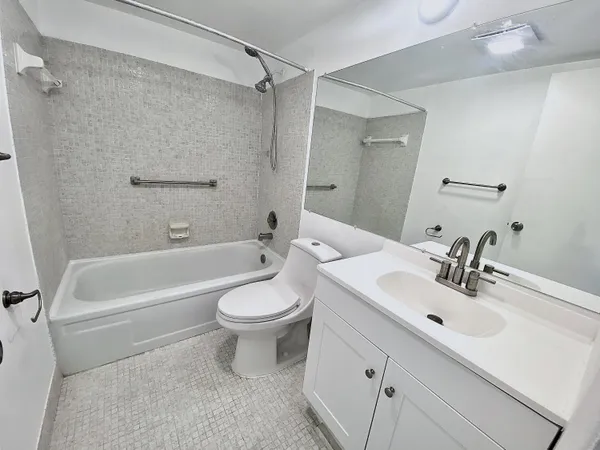 a view of a bathroom from the hallway