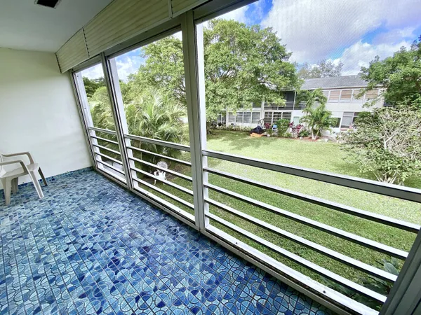 a view of a shop with tables and chairs