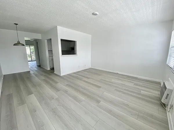 a view of a livingroom with wooden floor