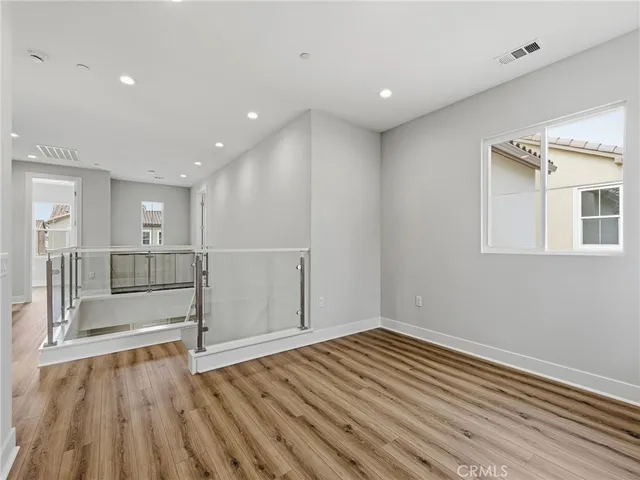 a spacious bathroom with a mirror a shower and a bathtub