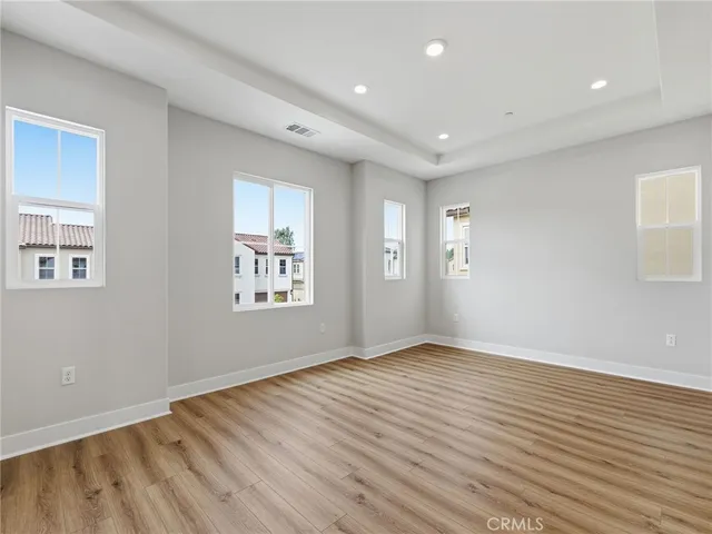 a white bath tub sitting next to a bathroom