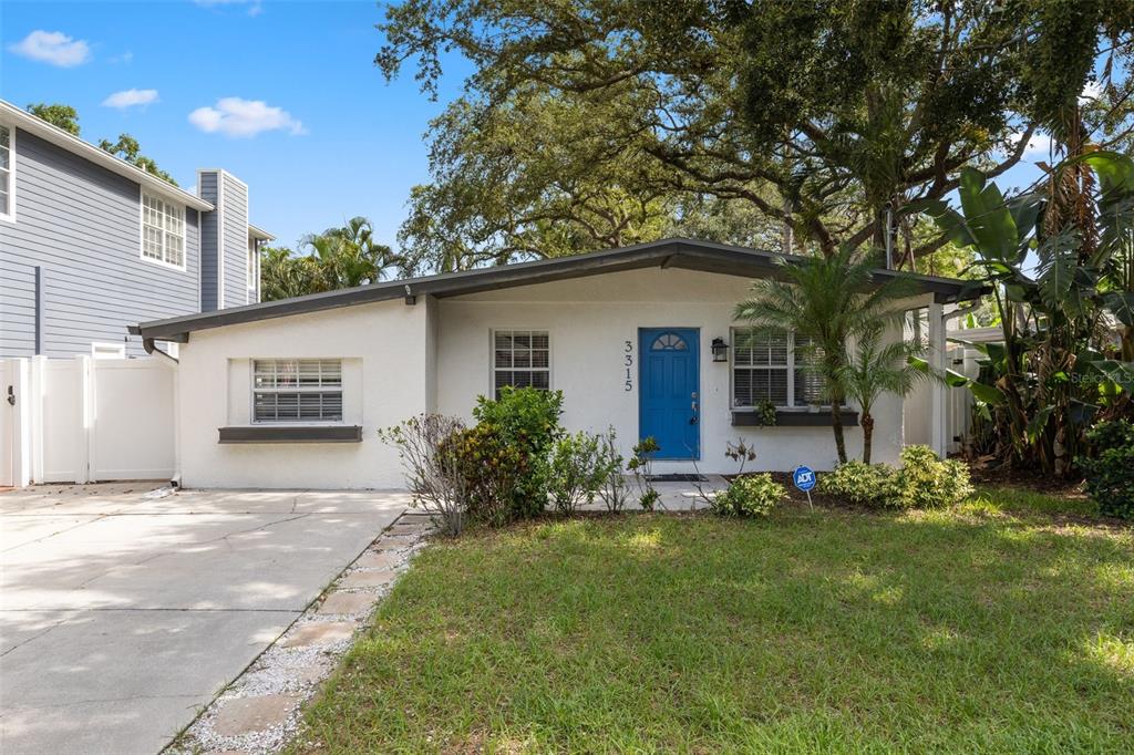 3315 West Villa Rosa Street Tampa, FL 33611 - Photo 1 of 1 a front view of a house with a yard
