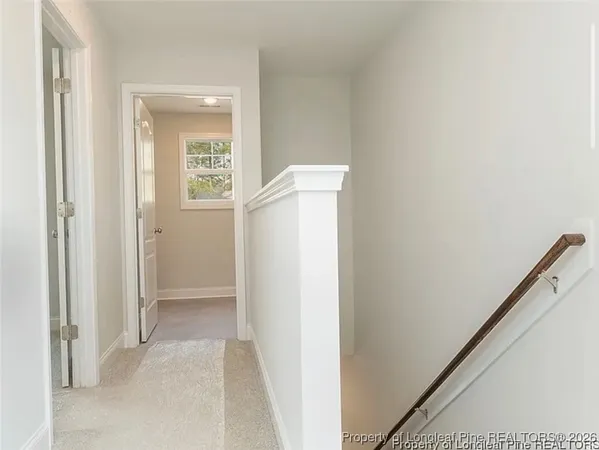 a view of an entryway with a hallway