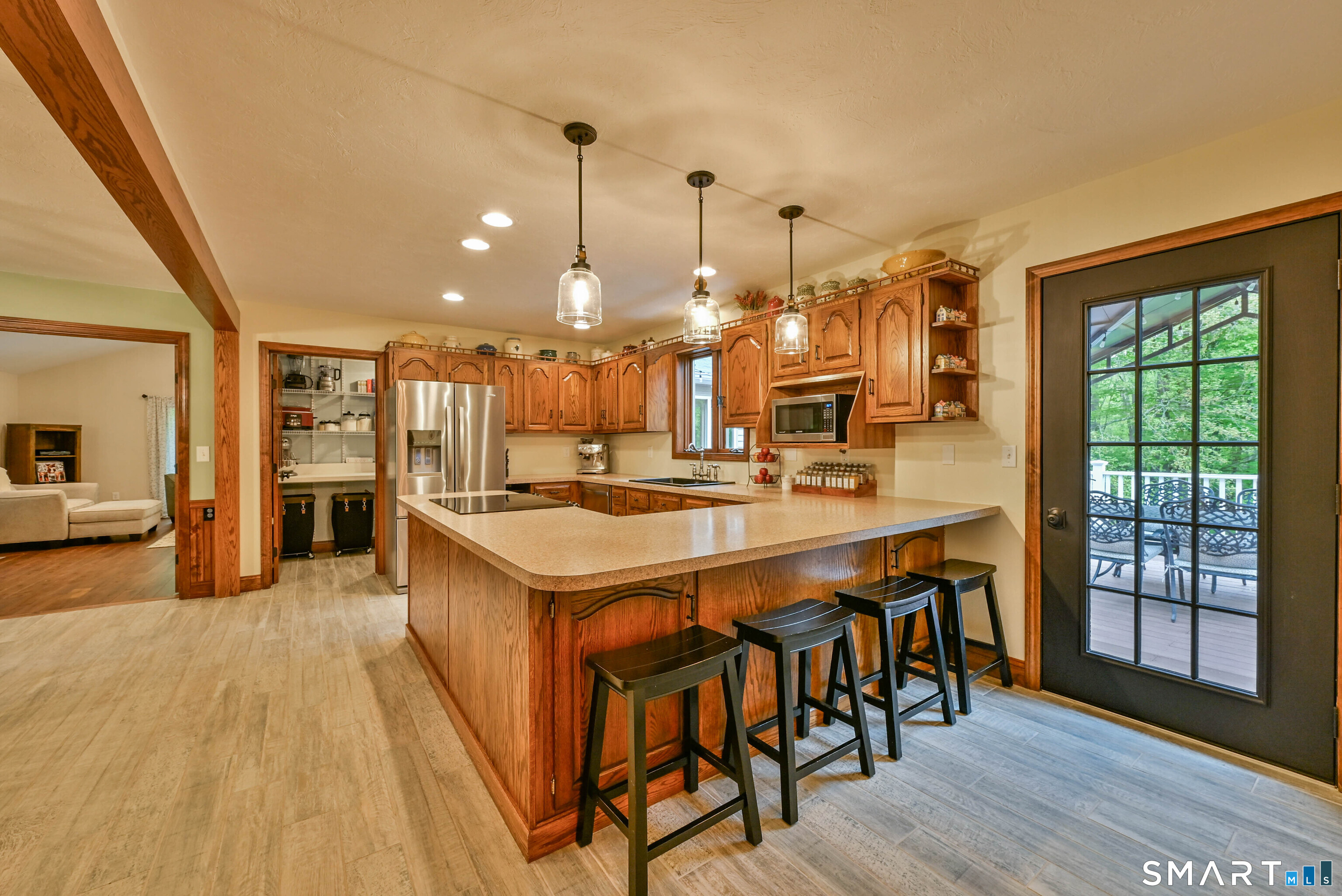 309 O'Leary Road Thompson, CT 06277 - Photo 26 of 40 a large kitchen with a large window and stainless steel appliances