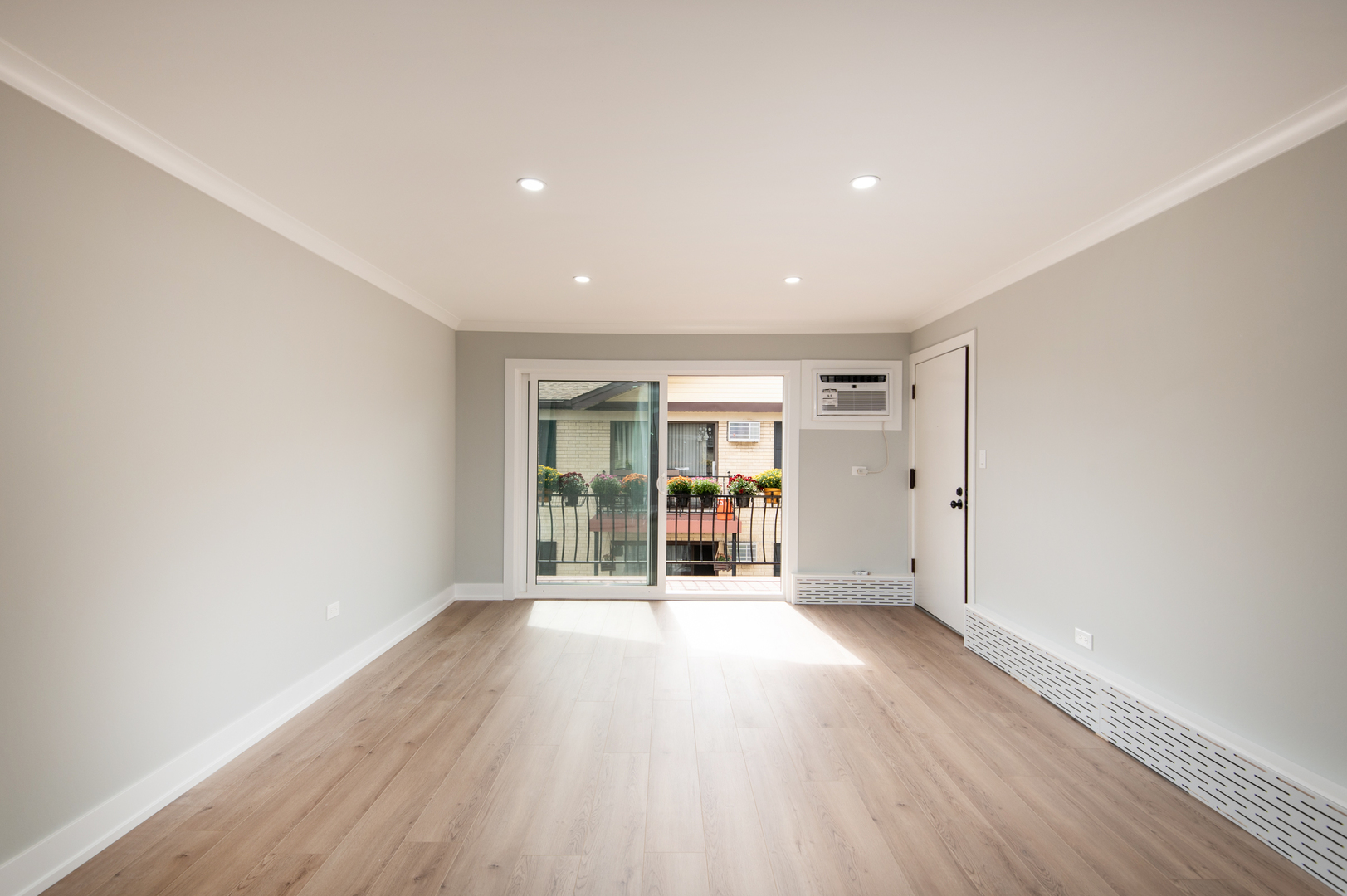 5159 North East River Road, Unit 312 Chicago, IL 60656 - Photo 19 of 42 an empty room with wooden floor and windows
