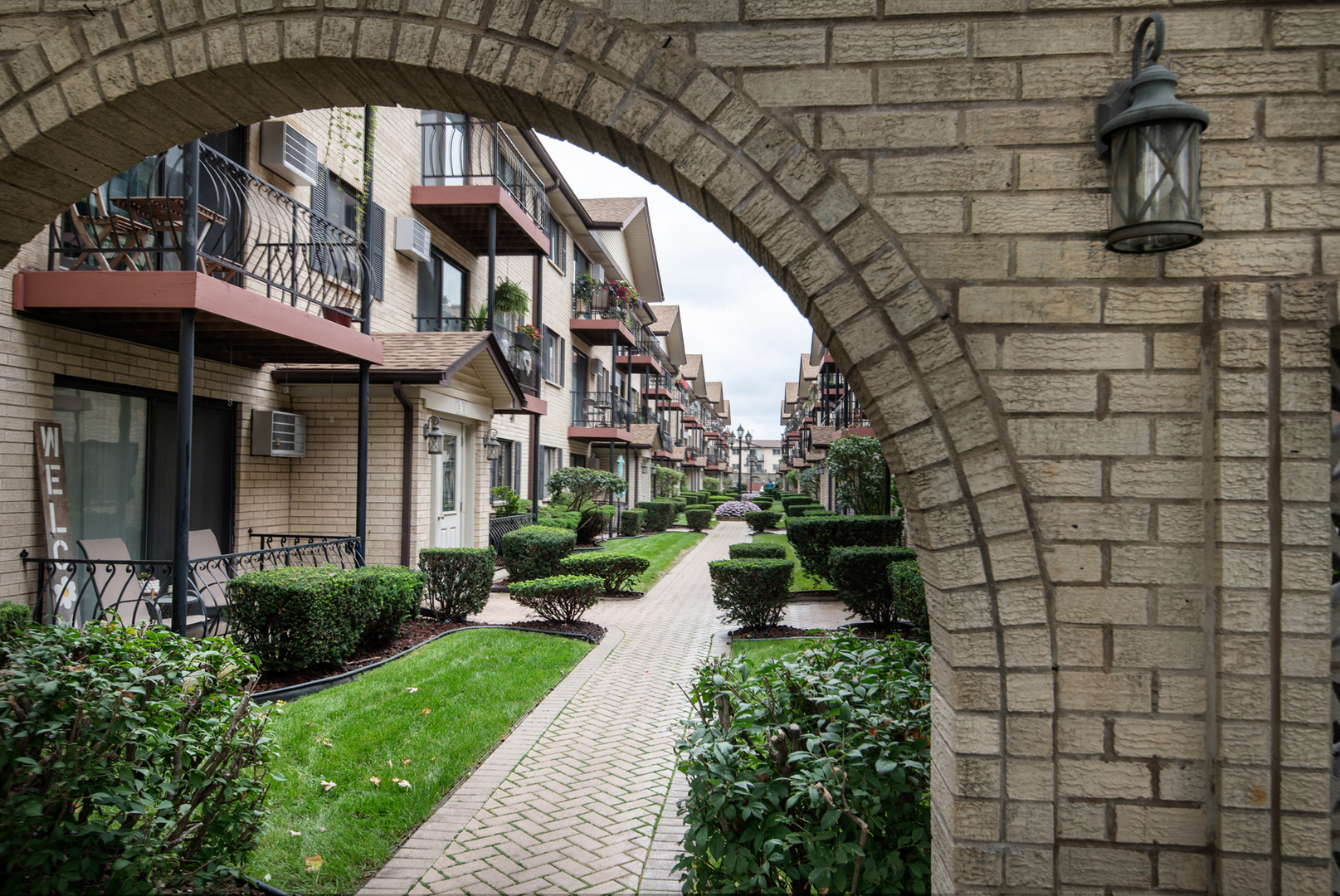 5159 North East River Road, Unit 312 Chicago, IL 60656 - Photo 2 of 42 a view of a brick building with a fountain