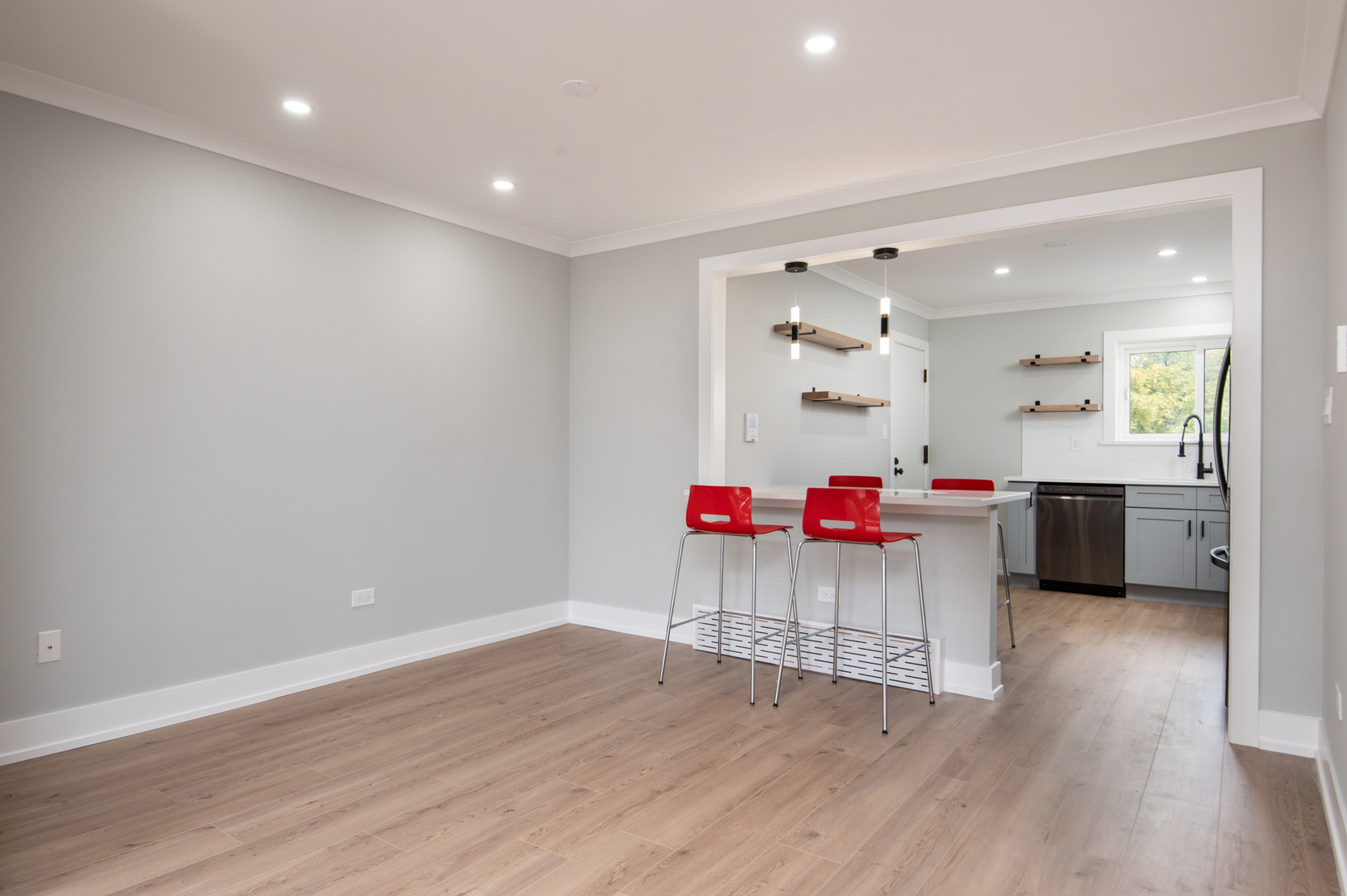 5159 North East River Road, Unit 312 Chicago, IL 60656 - Photo 21 of 42 a room with wooden floors and kitchen view