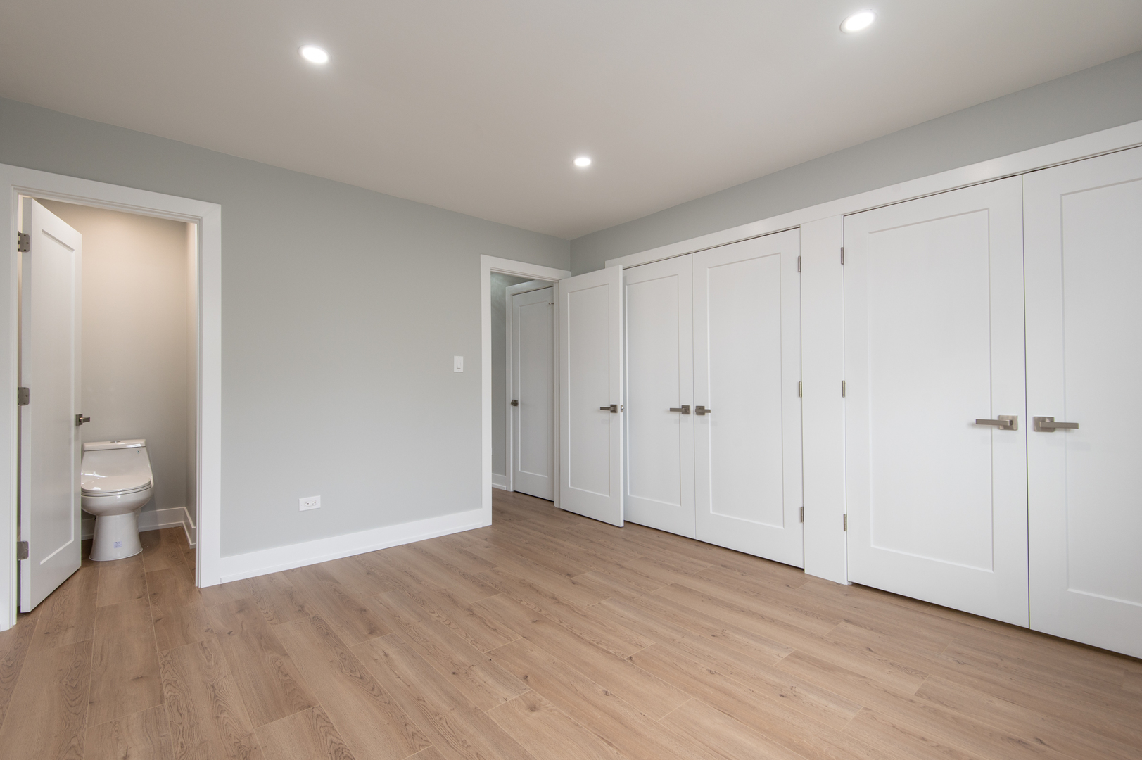 5159 North East River Road, Unit 312 Chicago, IL 60656 - Photo 23 of 42 a view of a room with wooden floor and windows
