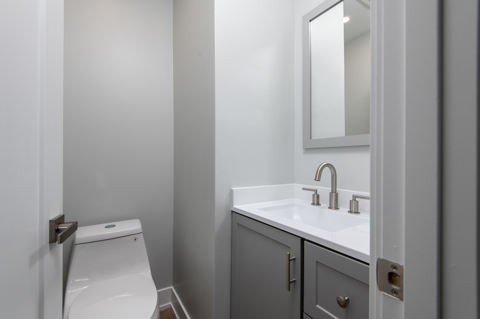 5159 North East River Road, Unit 312 Chicago, IL 60656 - Photo 25 of 42 a bathroom with a sink and a toilet